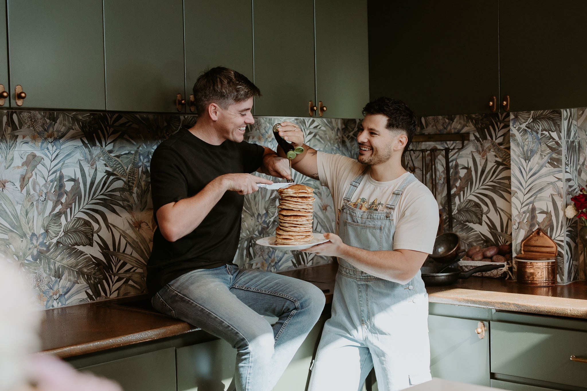 Jordan and Dane making pancakes in their kitchen